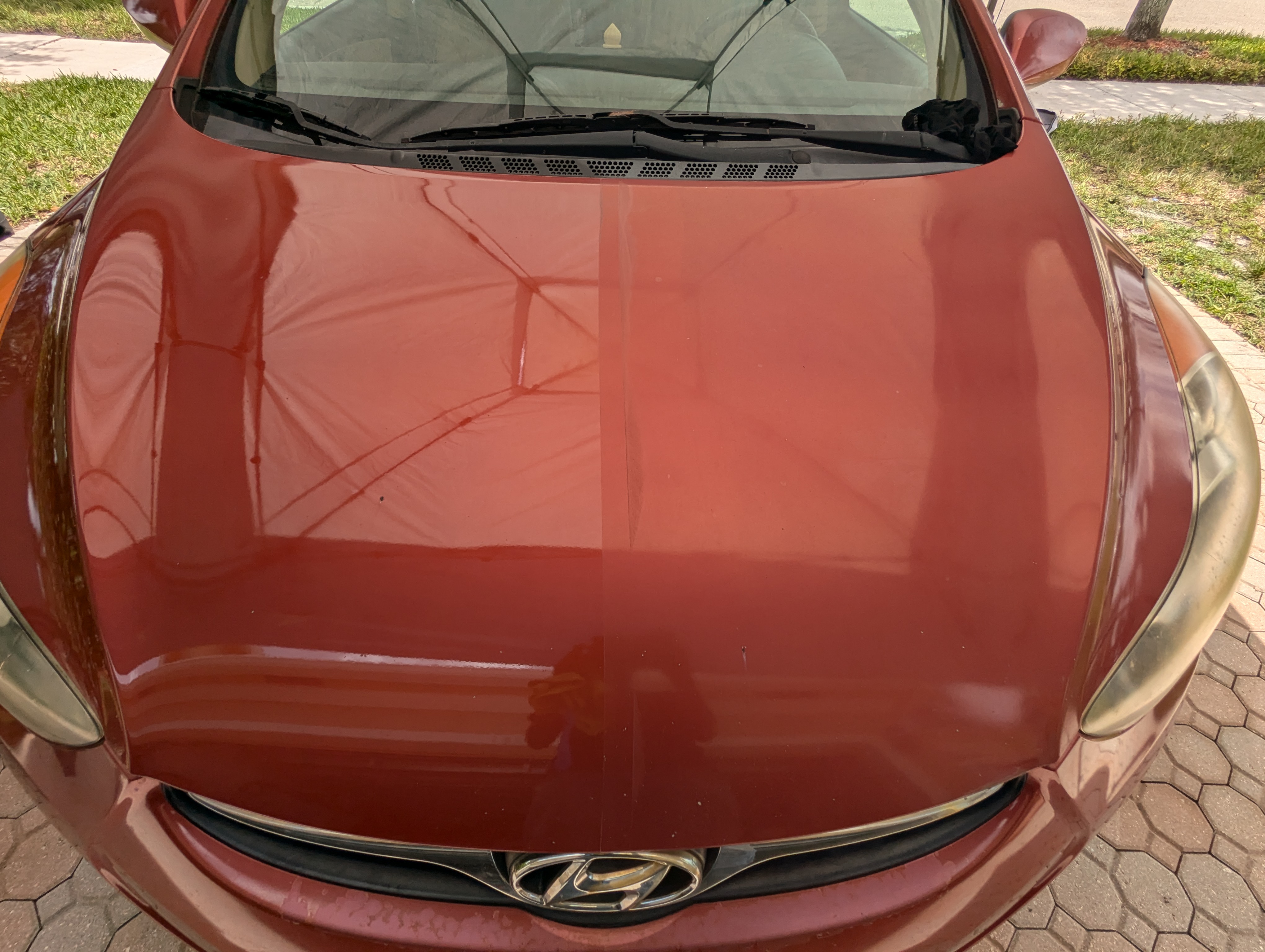 Revived the deep red paint on this Elantra with a paint enhancement in Pembroke Pines Fl